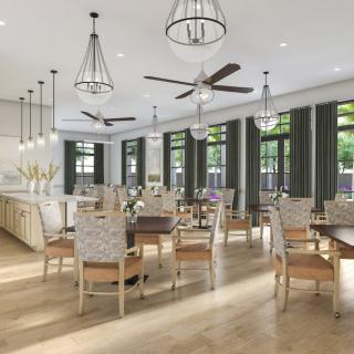 A spacious and elegantly designed dining area with modern chandeliers, ceiling fans, and abundant natural light.