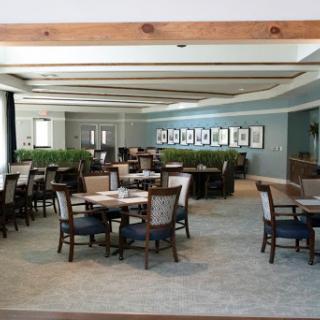 A spacious and elegantly designed dining area with ample seating and decorative elements.