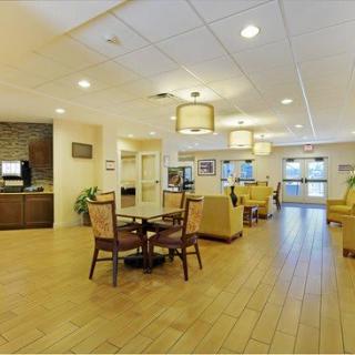 A spacious and modern lounge area with comfortable seating and ambient lighting.