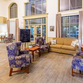 A cozy living room with comfortable seating and a warm ambiance.