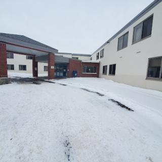 A snowy view of a building during winter.