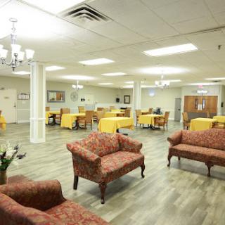 A spacious lounge area featuring comfortable seating and dining spaces, ideal for social gatherings.