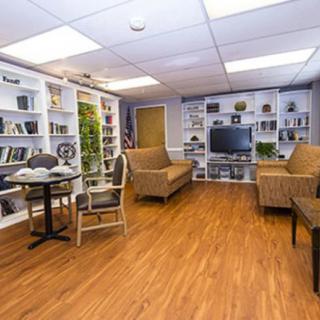 A cozy living room with comfortable seating and built-in shelves.