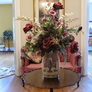 A beautifully arranged floral centerpiece in an elegant vase, enhancing the charm of the living space.