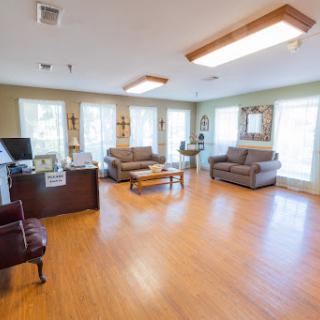 A spacious and inviting living room featuring comfortable seating and ample natural light.