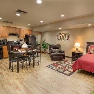 A cozy apartment featuring a modern living room, dining area, and kitchen.