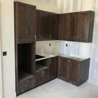 A set of unfinished kitchen cabinets in a contemporary design.