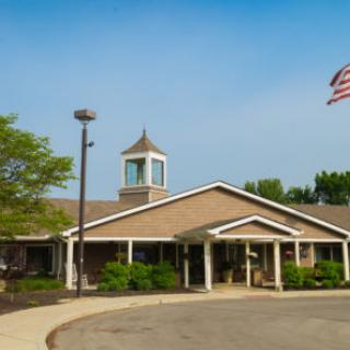 A community center with a flag and clear skies.