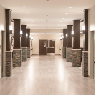 A modern hallway with elegant lighting and stylish architectural features.