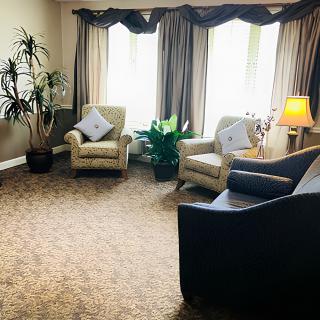Cozy living room with comfortable seating and ambient lighting.
