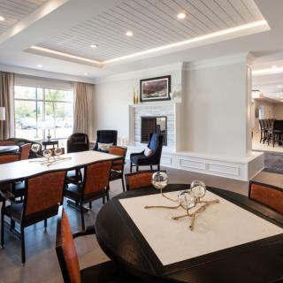 A modern dining area with elegant furnishings and ambient lighting.