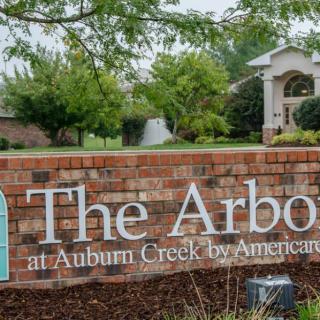 Entrance sign for 'The Arbors at Auburn Creek' neighborhood.