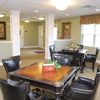 A cozy dining area with elegant furnishings and warm lighting.