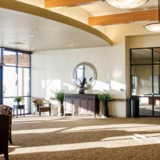 A spacious lobby area with modern decor and abundant natural light.