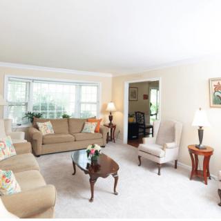 A cozy living room with comfortable seating and elegant decor.