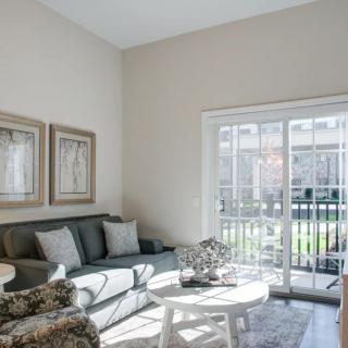 A bright and modern living room with comfortable seating and stylish decor.