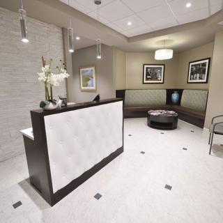 A modern reception area with a sleek design and comfortable seating.