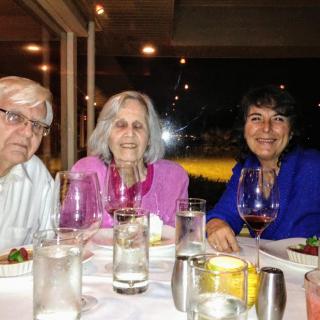 A group of people enjoying a meal together at a restaurant.