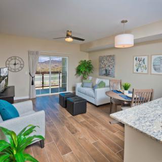 A modern living room featuring stylish furniture, natural light, and a welcoming atmosphere.