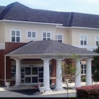 Front view of a building with a columned entrance.