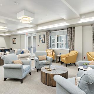 A modern and cozy living room with comfortable seating and stylish decor.