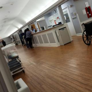 A view of the hospital interior showcasing the reception area and a waiting space.