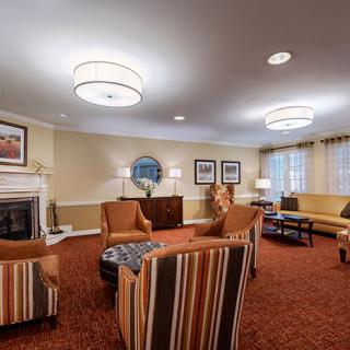 A cozy living room with comfortable seating and a fireplace.