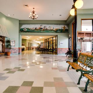 A spacious and inviting lobby with decorative elements, seating arrangements, and natural light.