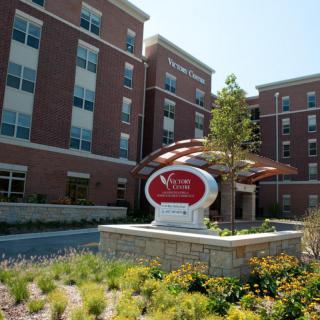 The exterior of a modern hospital building with a welcoming entrance.