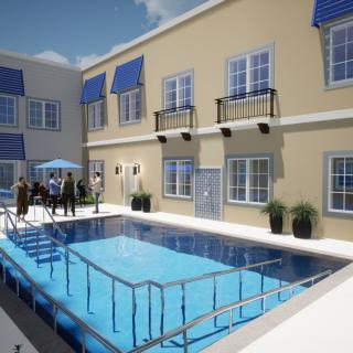 A modern apartment complex with a central swimming pool and blue awnings.