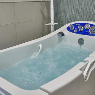 A luxurious indoor jacuzzi filled with water.