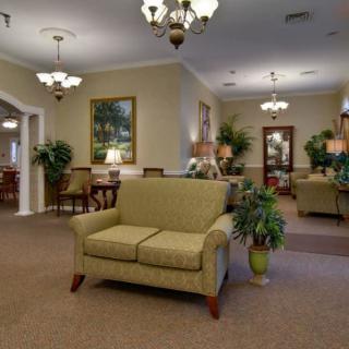 A cozy living room with elegant lighting and comfortable seating.