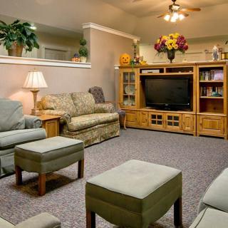 Cozy living room with comfortable seating and a television setup.