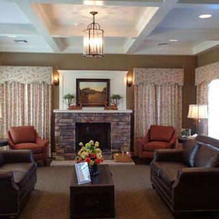 Cozy living room with comfortable seating and a fireplace.