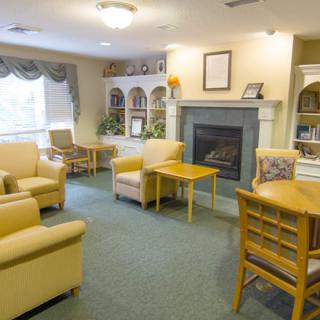 A cozy living room with comfortable seating and a fireplace.