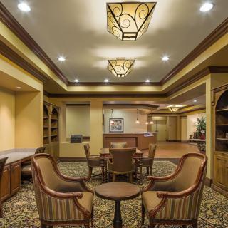 A hotel lobby with elegant seating and warm lighting.