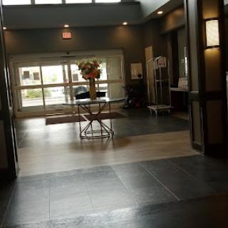 A welcoming lobby with a stylish flower arrangement and modern decor.