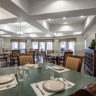 A well-arranged dining room with tables set for a meal.