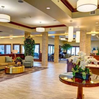 A modern lobby interior with comfortable seating and elegant lighting.