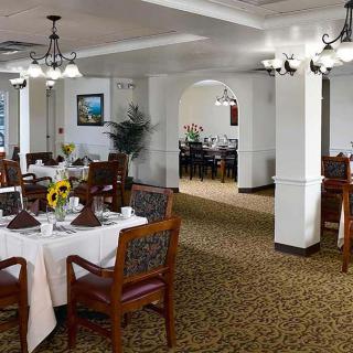 Elegant dining room with neatly arranged tables and classic decor.
