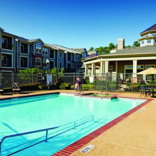 A sunny day at the swimming pool in an apartment complex.