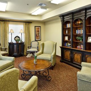 A cozy living room setup featuring comfortable seating and a stylish bookshelf.