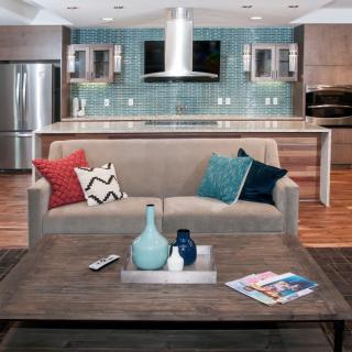 A modern open-plan living room and kitchen with stylish decor.