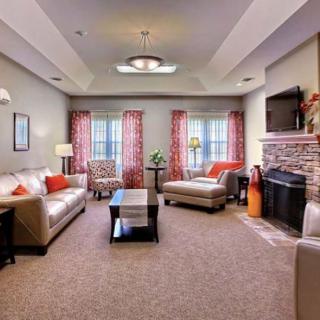 A cozy and inviting living room with elegant furnishings and a warm color scheme.