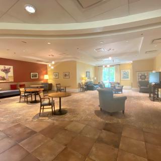 A spacious and well-lit lobby with comfortable seating arrangements and elegant decor.