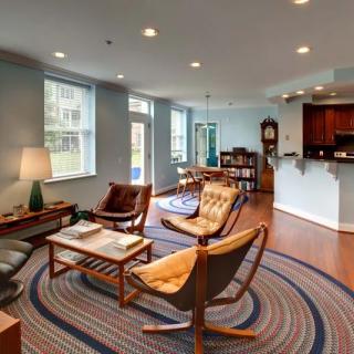 A modern living room with contemporary furniture and abundant natural light.