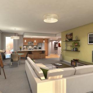 Modern open-concept living room and kitchen with sleek furnishings.