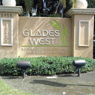 Sign welcoming visitors to Glades West community.