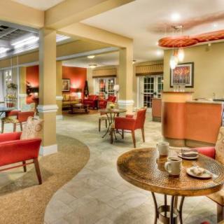 A cozy restaurant interior with warm lighting and comfortable seating.