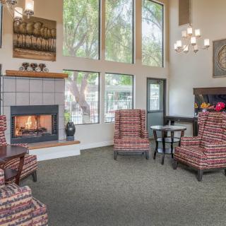A cozy living room with a fireplace and comfortable seating.
